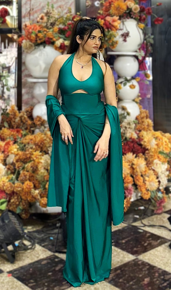 rooshy Mehraz Emerald Drape Set - model looking sideways showing front knot drape on emerald satin set