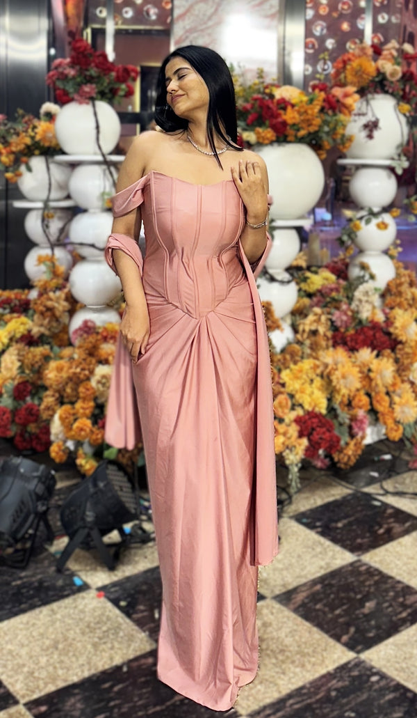 rooshy Adaa Luxe Drape Set - model looking up showing draped front knot and corset silhouette marigold backdrop