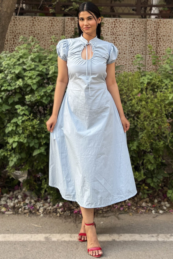 rooshy Blue Elan Collar Dress - smiling model in sky blue collar dress paired with red block heels