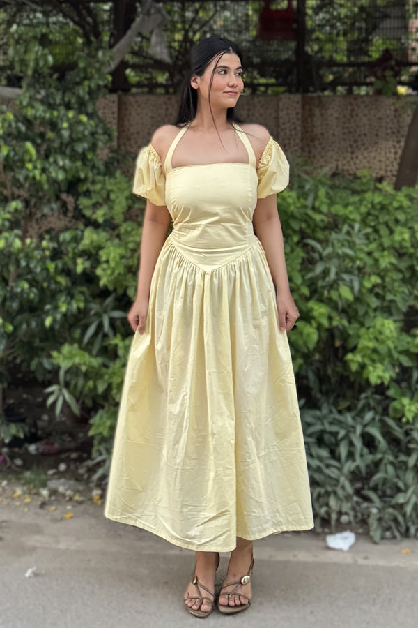 rooshy Butter Babe Corset Dress - butter yellow puff sleeve off-shoulder midi dress standing outdoors