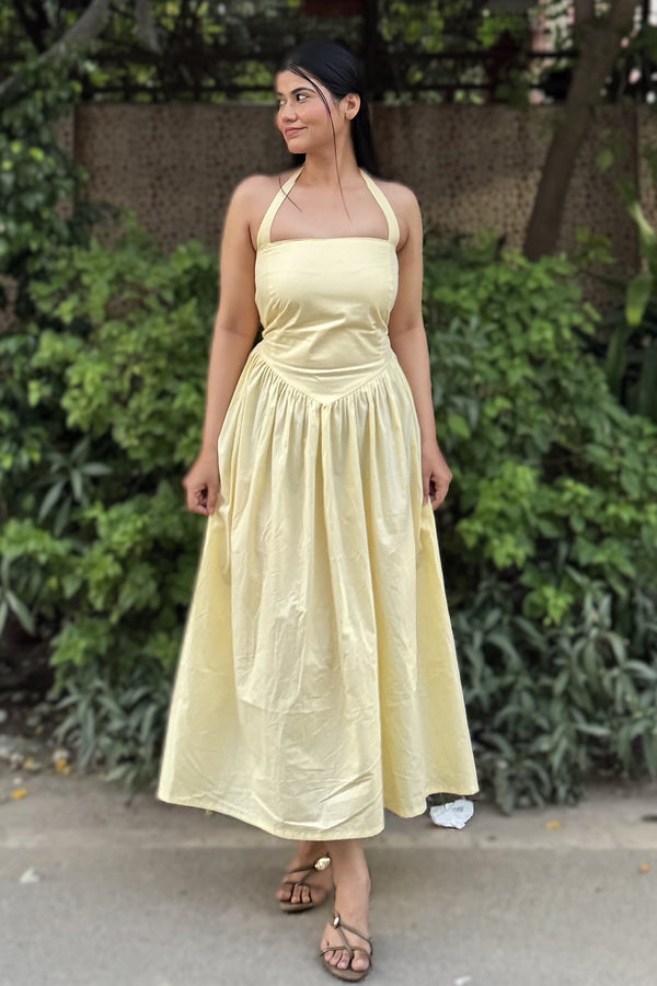 rooshy Butter Babe Corset Dress - yellow halter corset dress model posing with leg forward