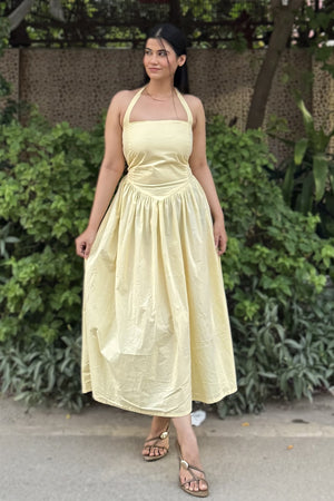 rooshy Butter Babe Corset Dress - yellow halter neck flared midi dress full length side-facing view