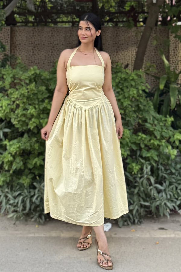 rooshy Butter Babe Corset Dress - yellow halter neck flared midi dress full length side-facing view