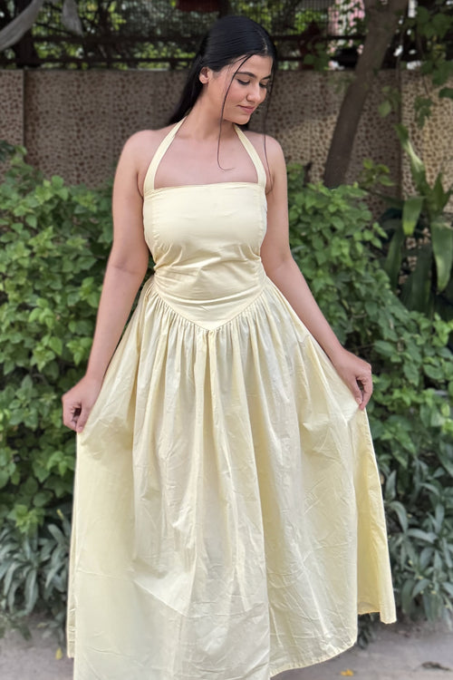 rooshy Butter Babe Corset Dress - close-up of model holding flared skirt sides showing corset waist