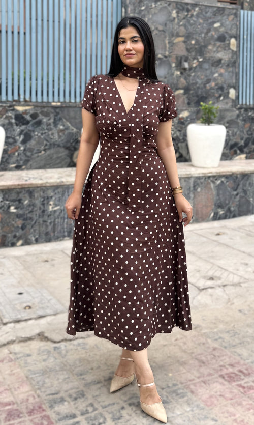 rooshy brown polka dot choker midi dress - full length front view model smiling outdoors stone wall