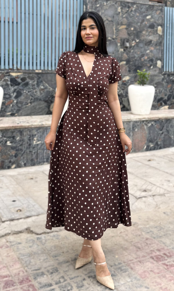 rooshy brown polka dot choker midi dress - full length front view model smiling outdoors stone wall